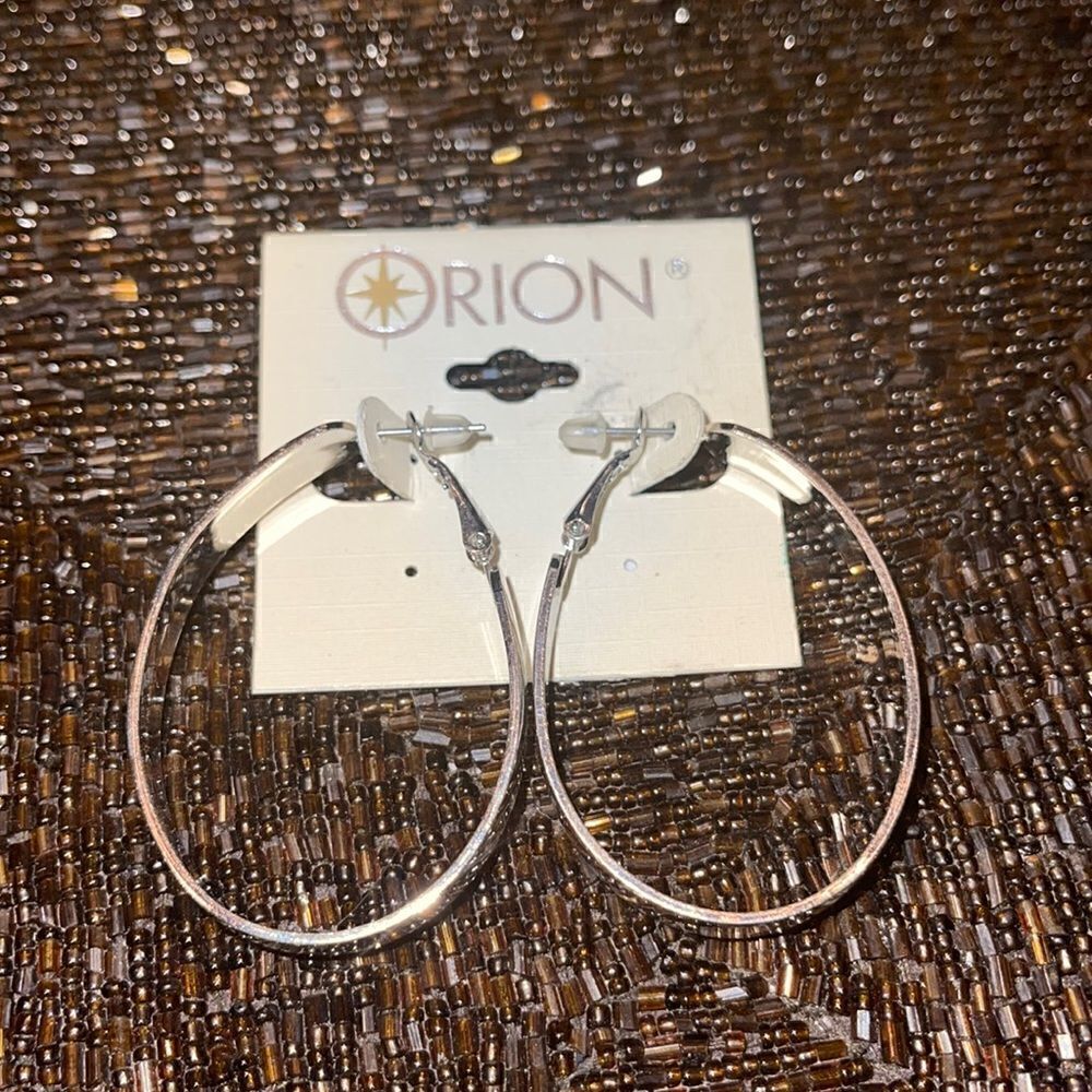 Orion oval hoop earrings silver tone.